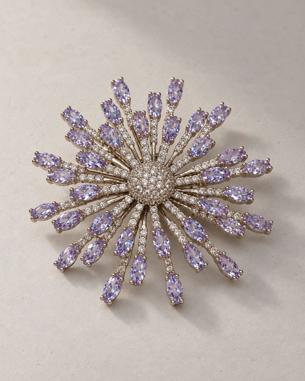Oblique display of Viola showing staggered silver-tone rays and raised stone tips