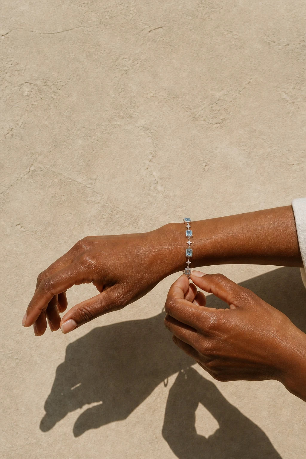 Celeste Blue Zircon Star Bracelet fastened in morning sunlight
