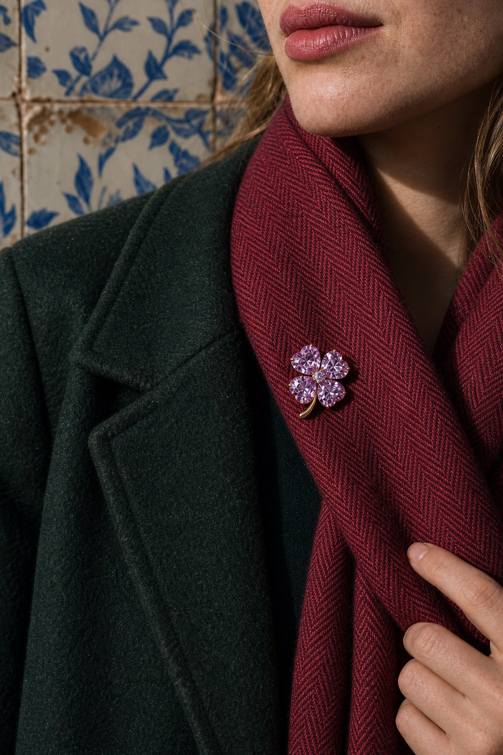Lavender clover brooch worn at a scarf fold